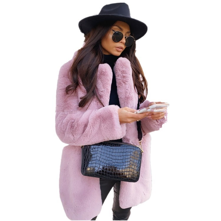 Woman wearing long faux fur coat with lapel collar