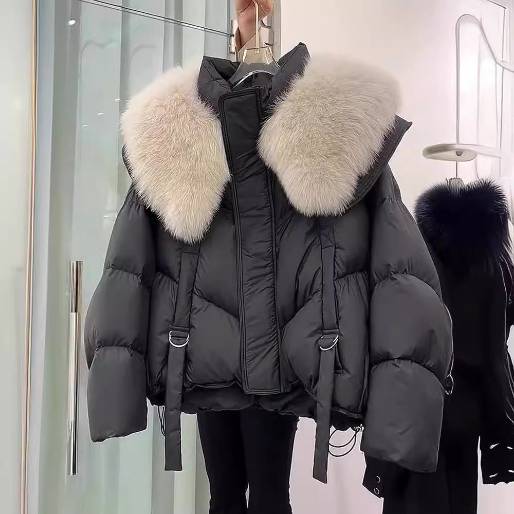 Woman wearing black padded winter coat with fur collar