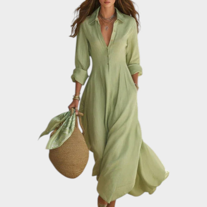 Woman wearing green button front maxi dress with long sleeves