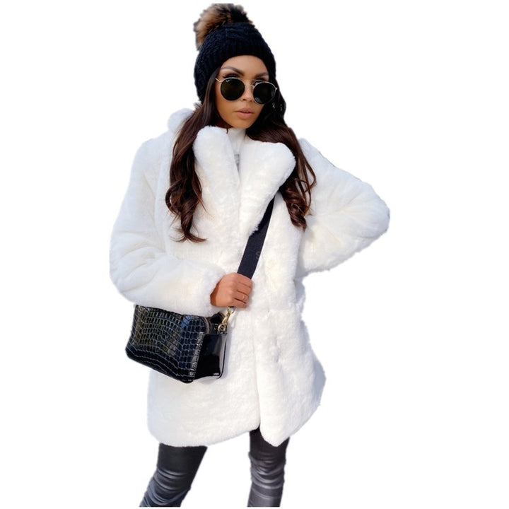 Woman wearing long faux fur coat with lapel collar