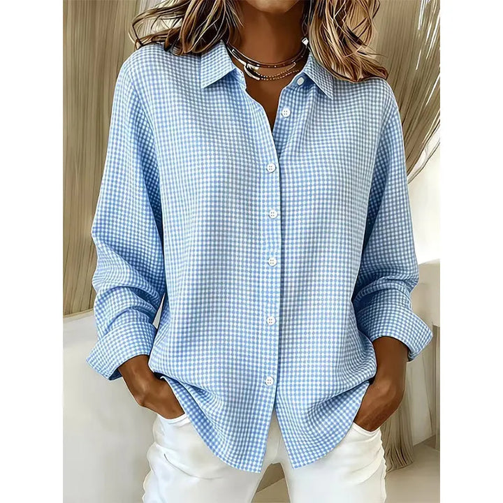 Woman wearing gingham button-up blouse with long sleeves
