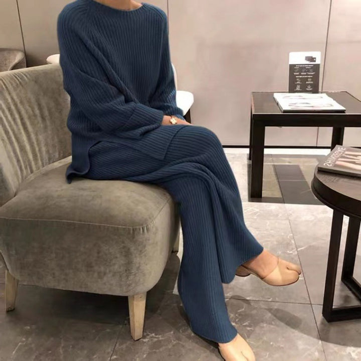 Woman wearing knit sweater top and wide-leg pants suit