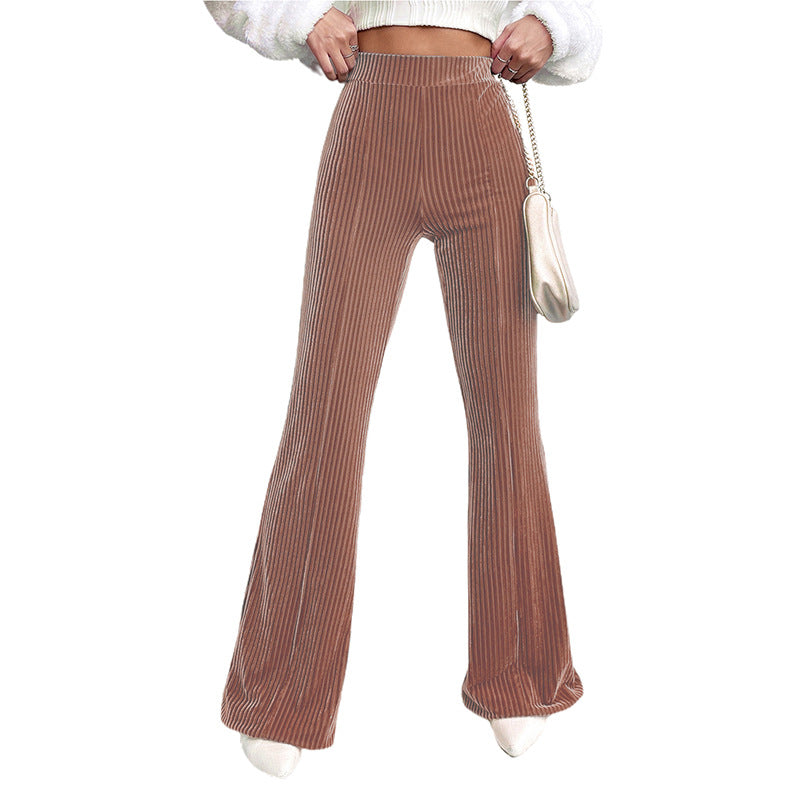 Woman wearing brown high waist corduroy wide leg pants