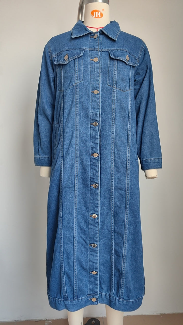 Woman in washed blue long denim coat, street style