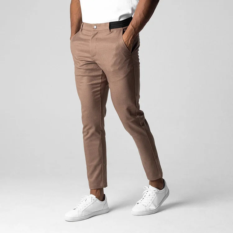 Man wearing slim straight business dress pants