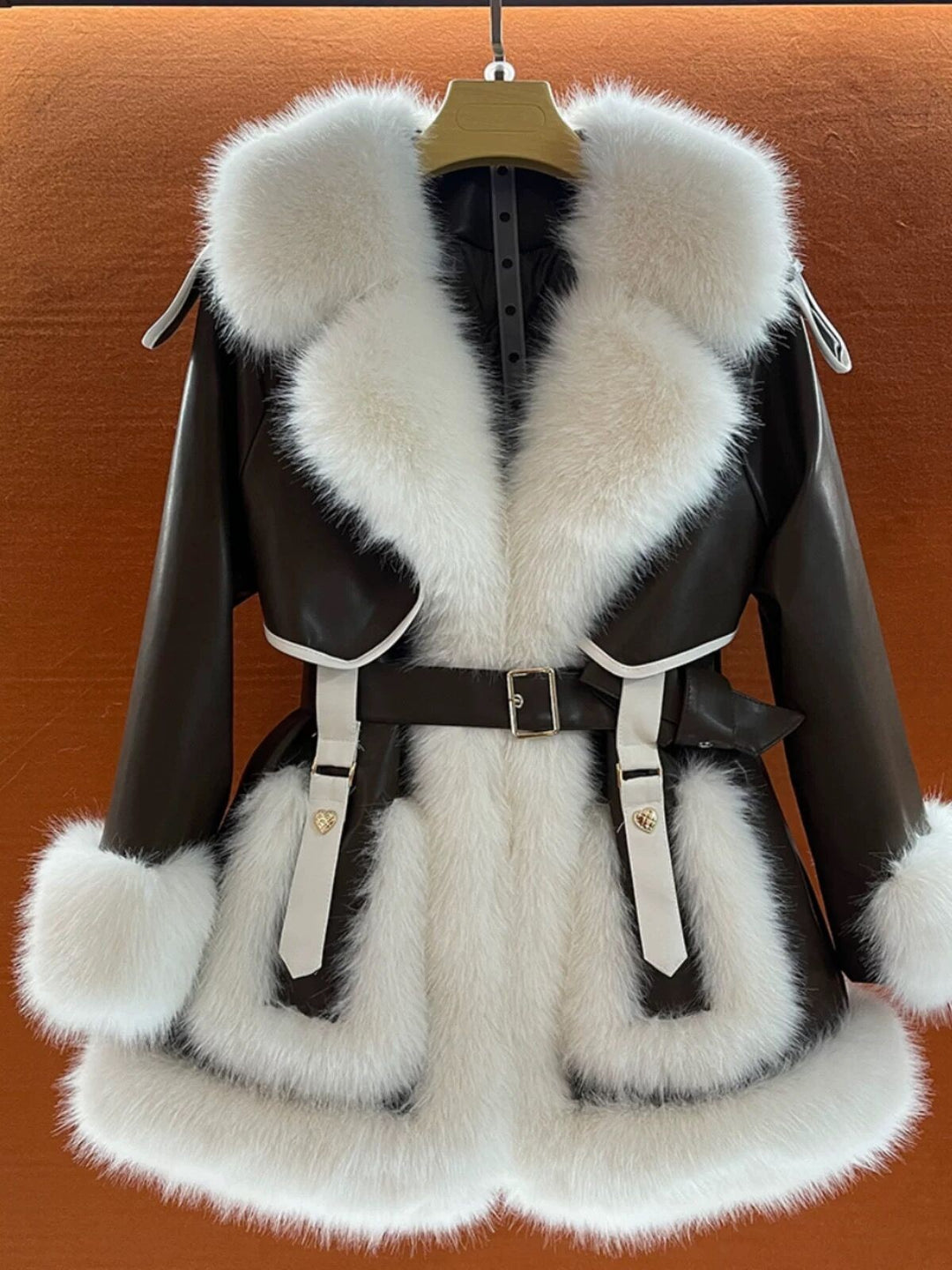 Woman wearing beige faux fur coat with fur collar
