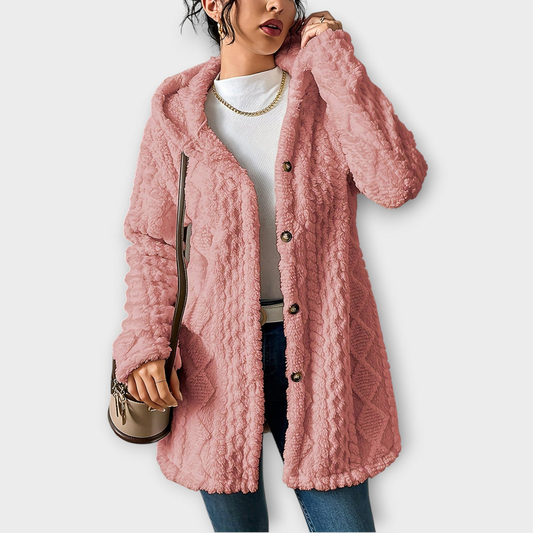 Woman wearing textured hooded winter jacket with relaxed fit