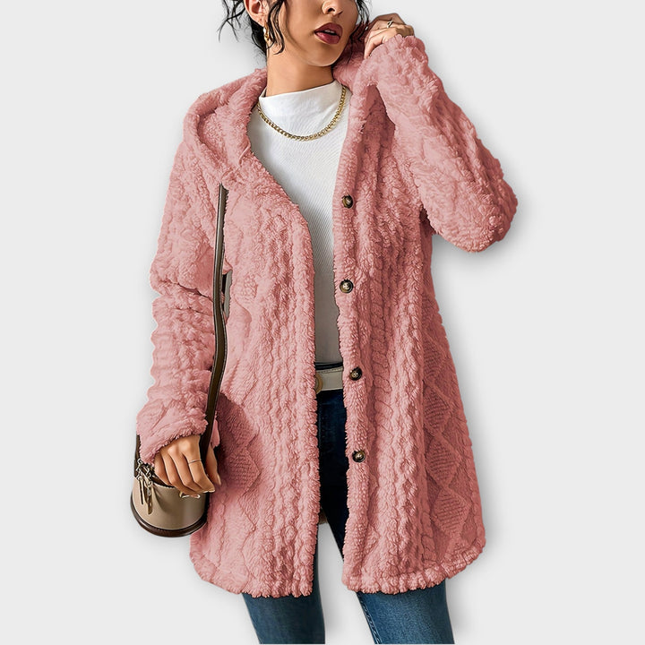 Woman wearing textured hooded winter jacket with relaxed fit