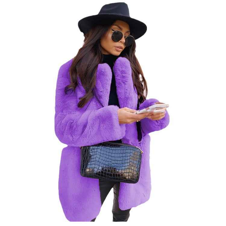 Woman wearing long faux fur coat with lapel collar
