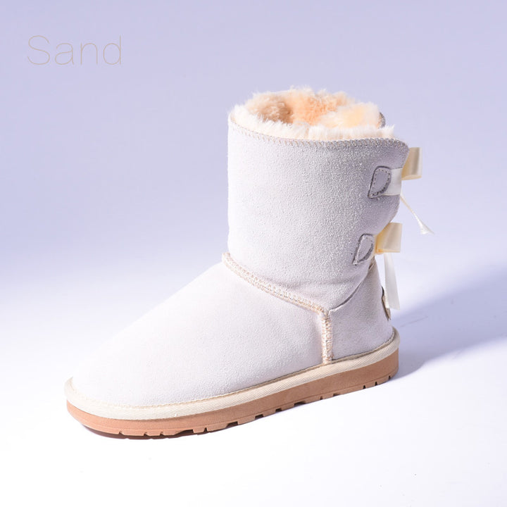 Women's mid-calf snow boots with fur lining and bow detail