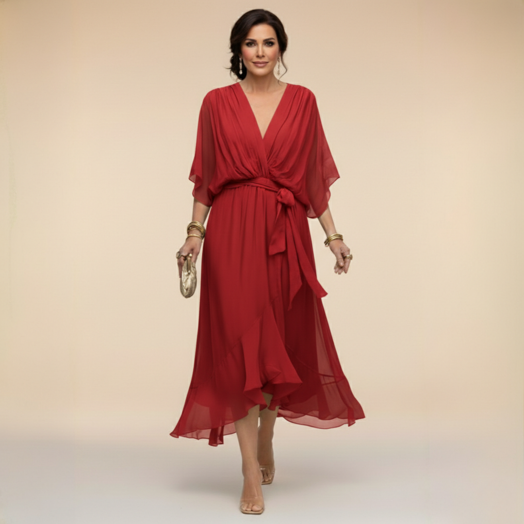 Woman wearing flowy V-neck dress, front view