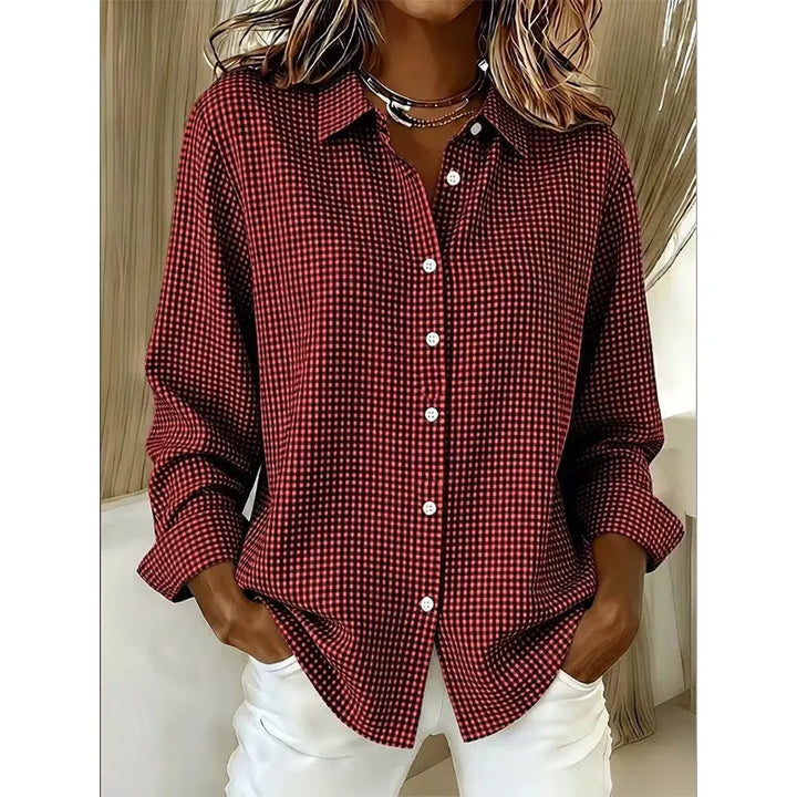 Woman wearing gingham button-up blouse with long sleeves