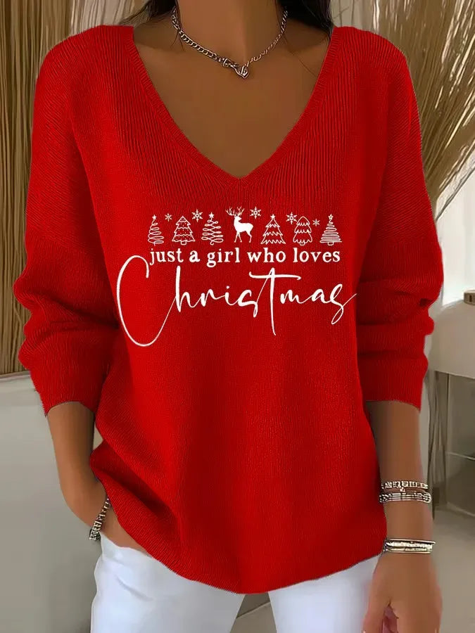 Woman wearing festive V-neck Christmas sweater indoors