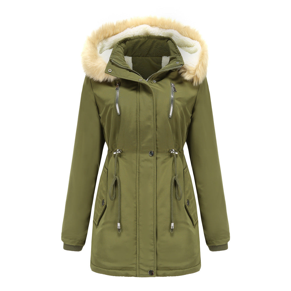 Woman wearing black hooded winter coat with faux wool collar