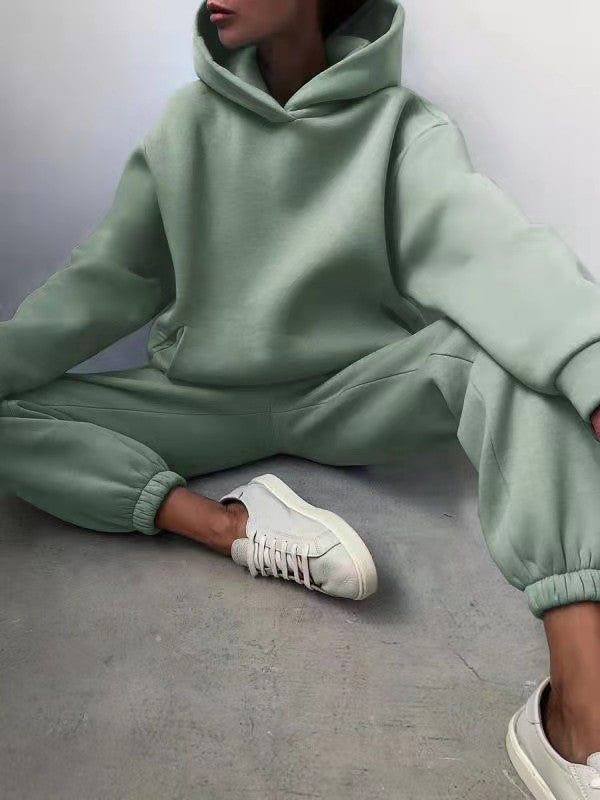 Woman wearing matching hooded knit tracksuit set – green