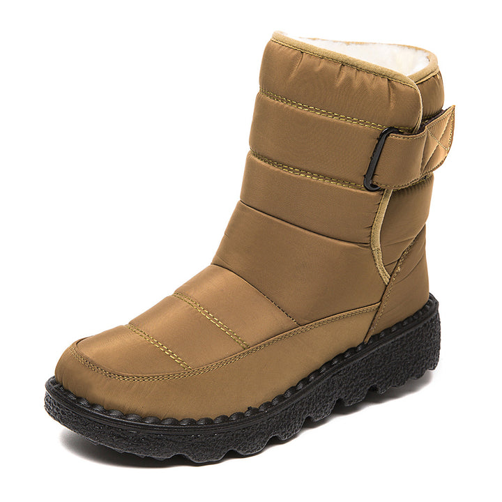 Woman wearing black plush-lined snow boots with buckle