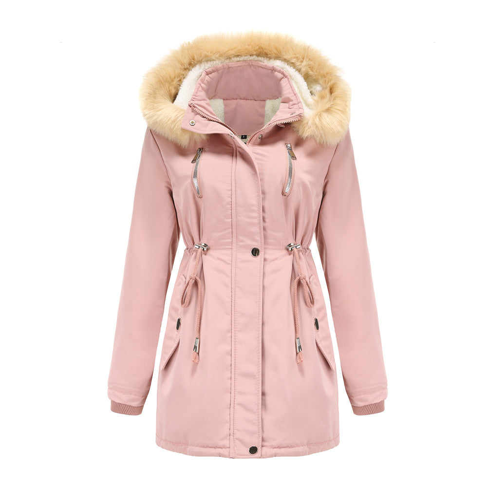 Woman wearing black hooded winter coat with faux wool collar