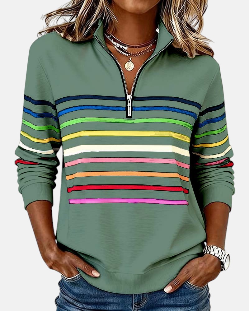 Woman wearing rainbow striped zip sweatshirt with stand collar