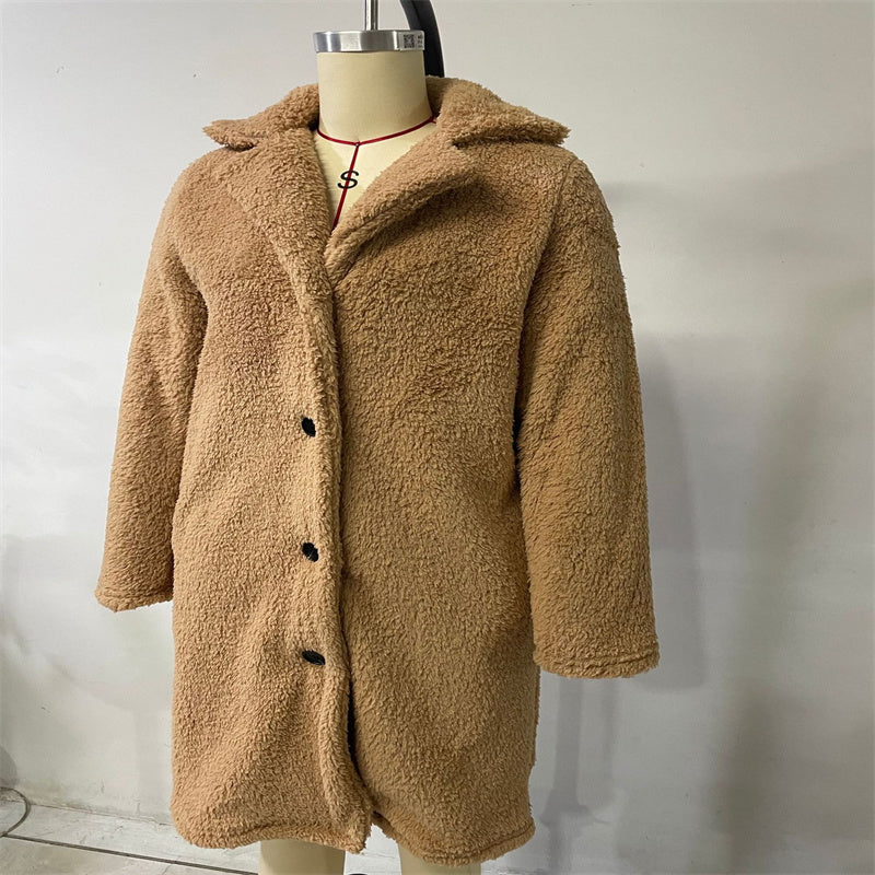 Woman wearing long lapel coat with fur collar