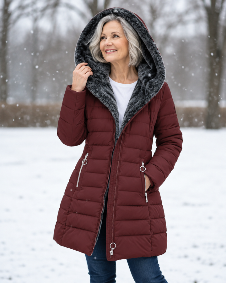 Woman wearing padded winter coat with hood