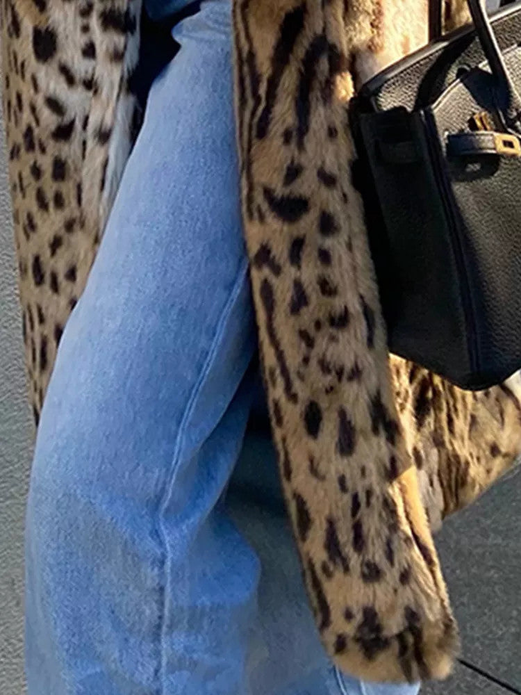 Woman wearing long leopard print faux fur coat