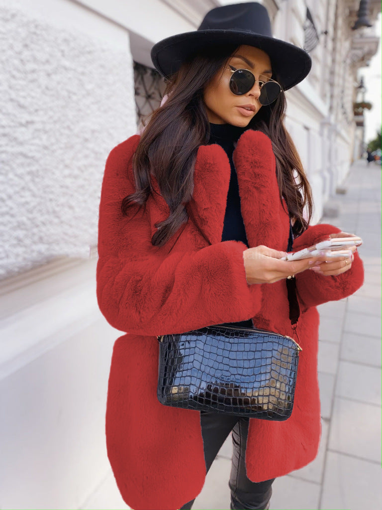 Woman wearing long faux fur coat with lapel collar