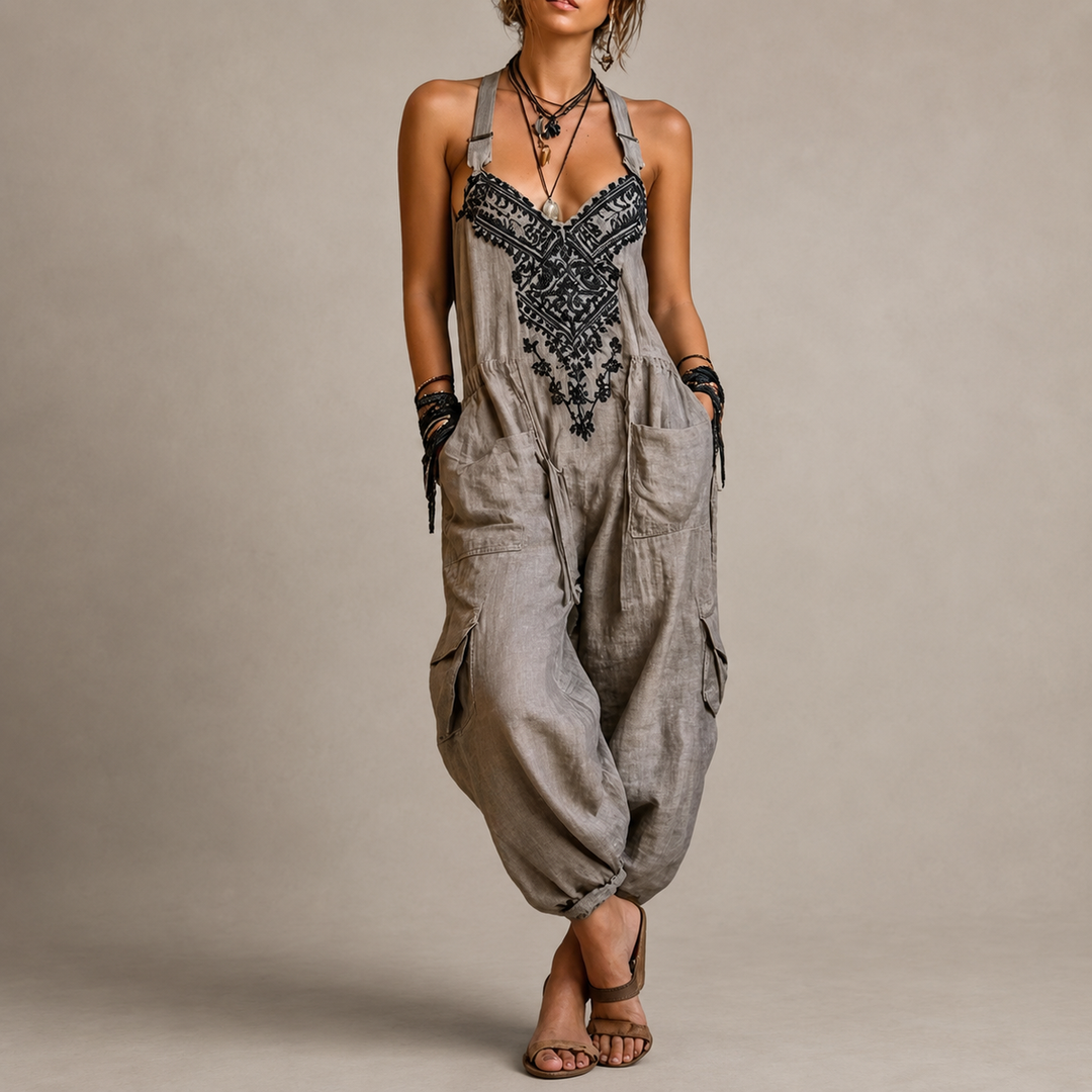Woman wearing embroidered boho harem jumpsuit with V-neck