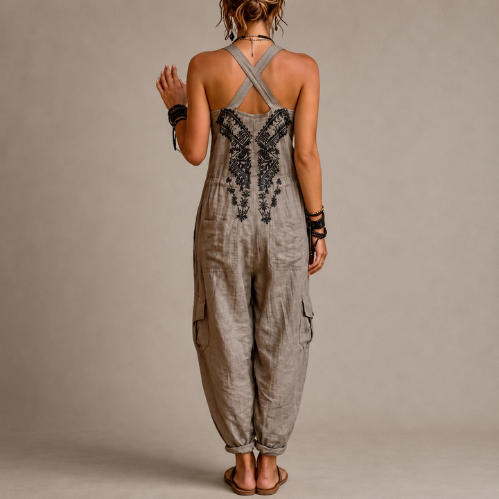 Woman wearing embroidered boho harem jumpsuit with V-neck