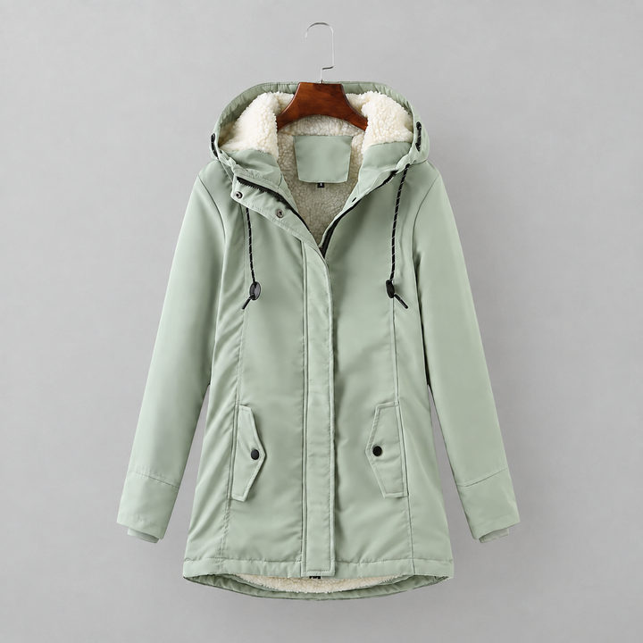 Woman wearing long quilted winter coat with hood