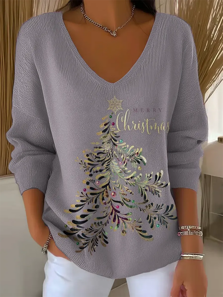 Woman wearing festive V-neck Christmas sweater indoors