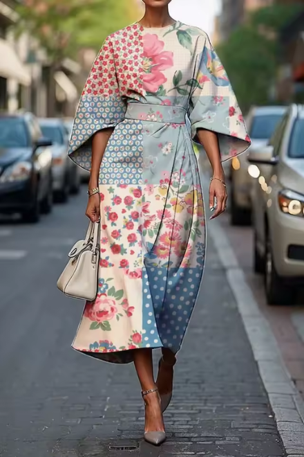 Woman wearing pink and green floral dress outdoors
