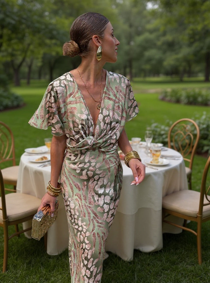 Woman wearing maxi dress with deep V-neck and wrap waist