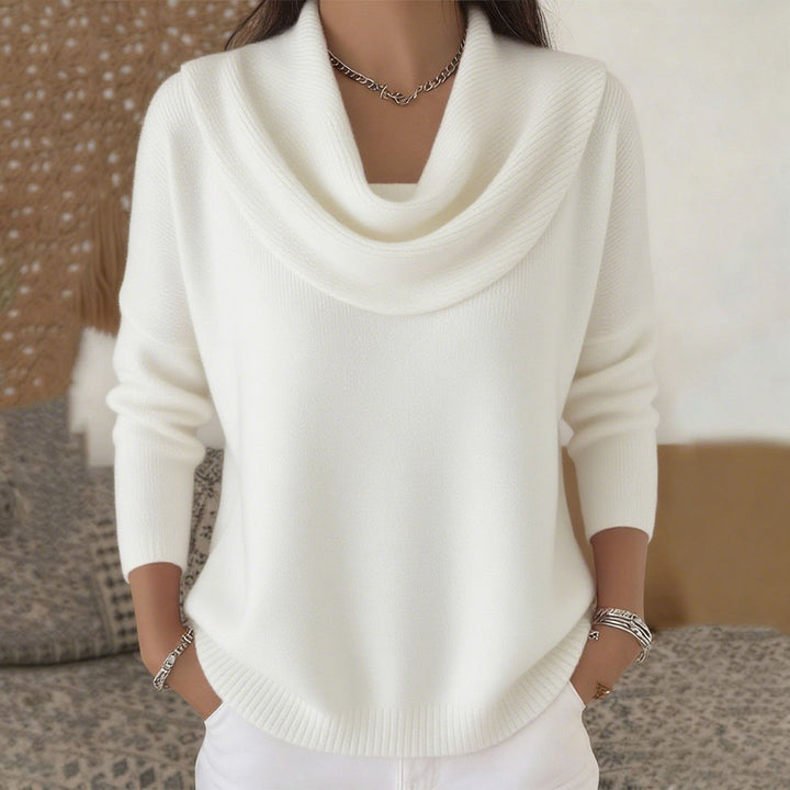 Woman wearing relaxed cowl neck knit sweater