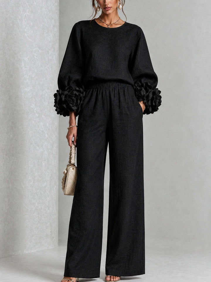 Woman wearing floral two-piece set with wide-leg pants