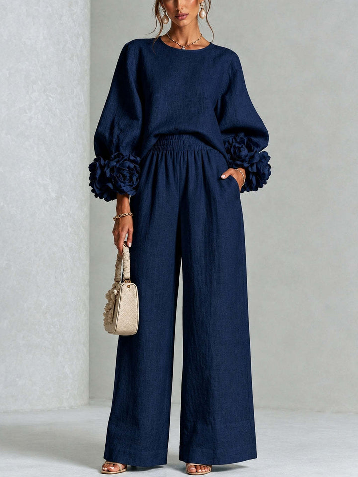 Woman wearing floral two-piece set with wide-leg pants