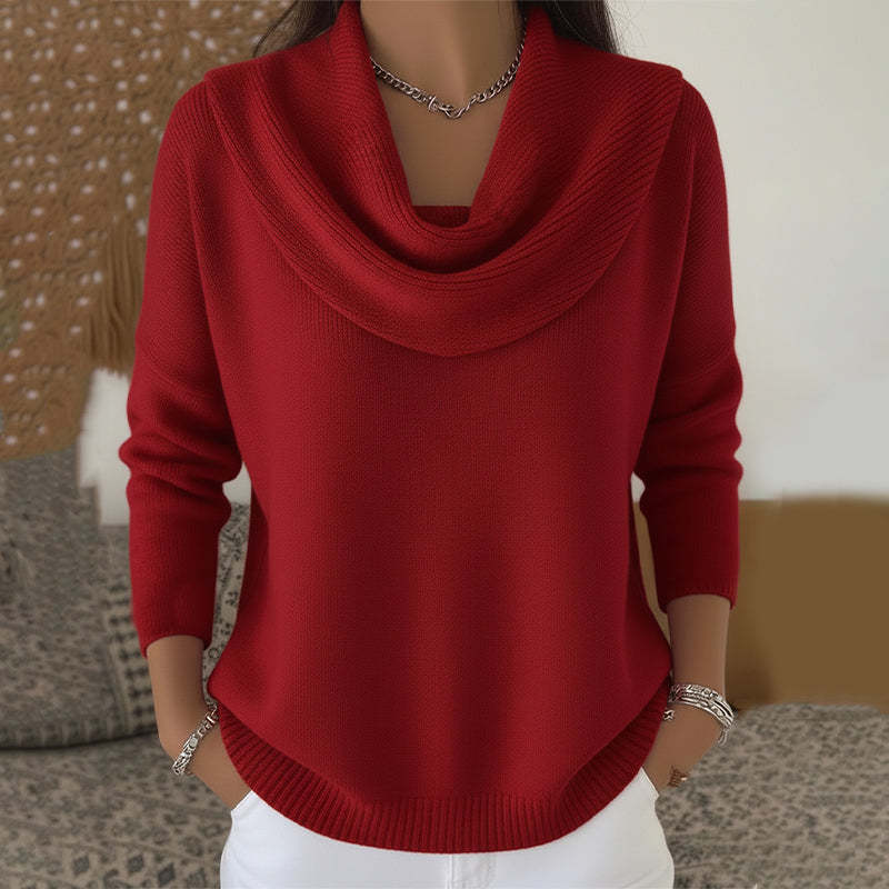 Woman wearing cowl neck knit sweater with ribbed cuffs