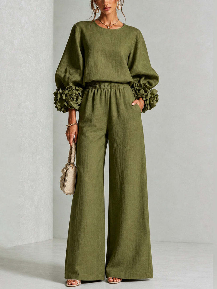 Woman wearing floral two-piece set with wide-leg pants