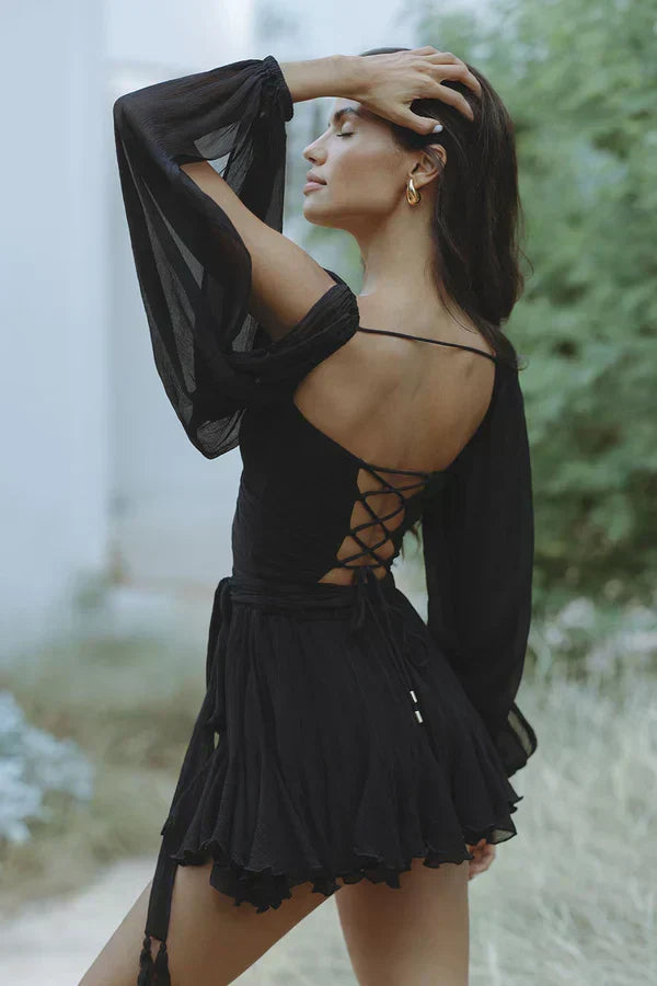 Woman wearing a flattering mini dress in black