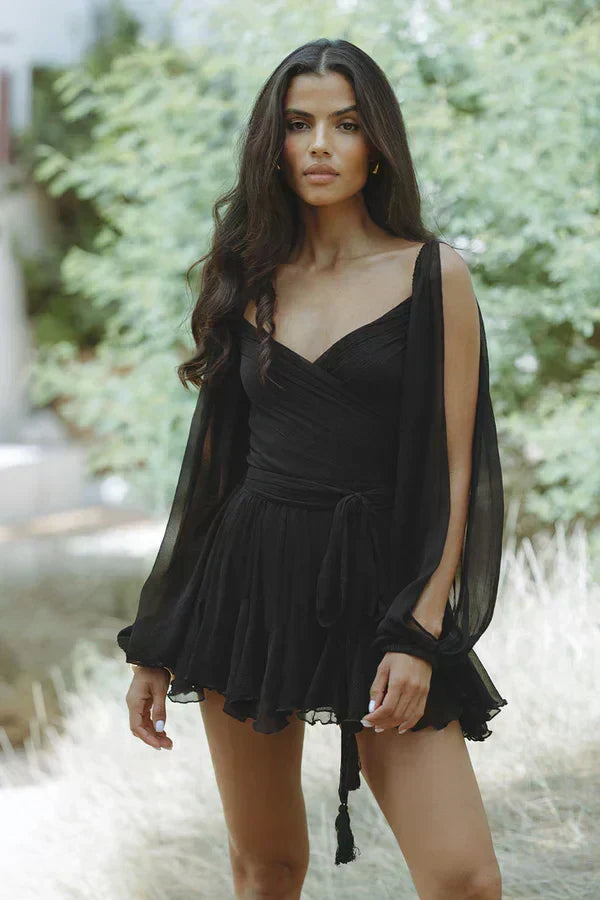 Woman wearing a flattering mini dress in black