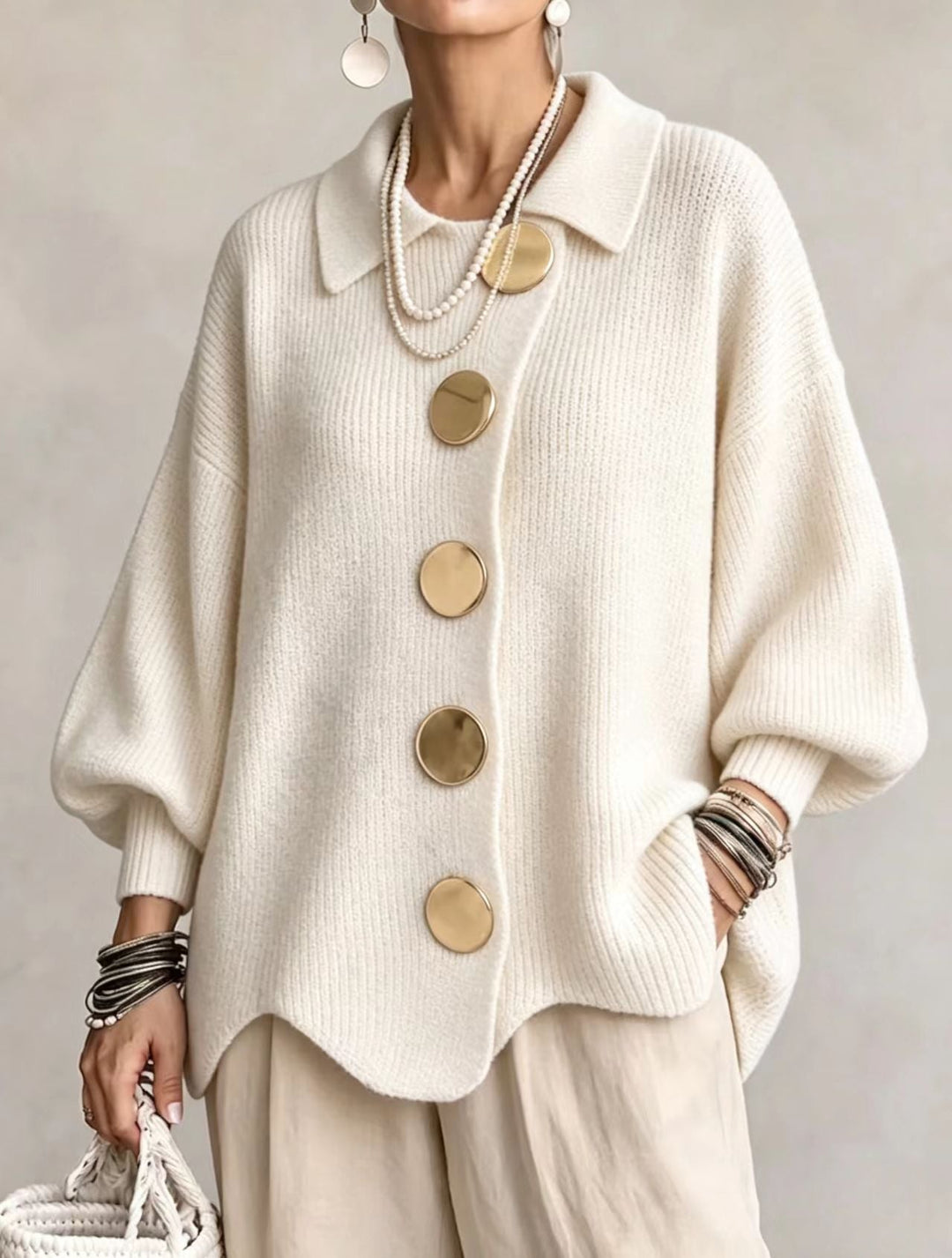 Woman wearing oversized cardigan with lantern sleeves