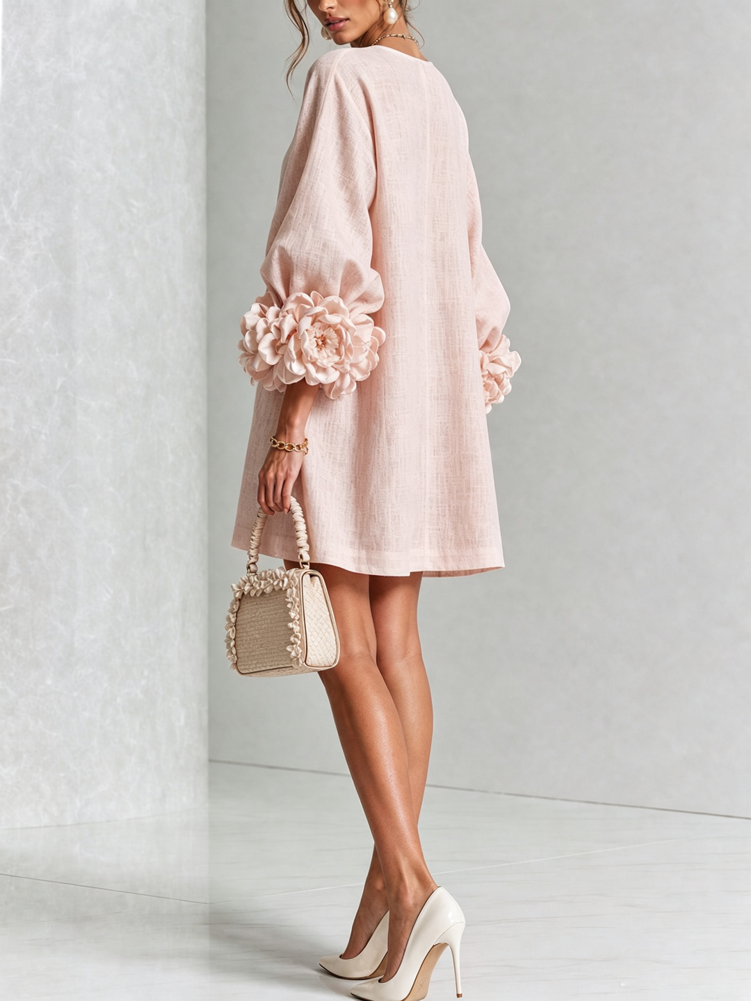 Pink floral mini dress with rosette cuffs