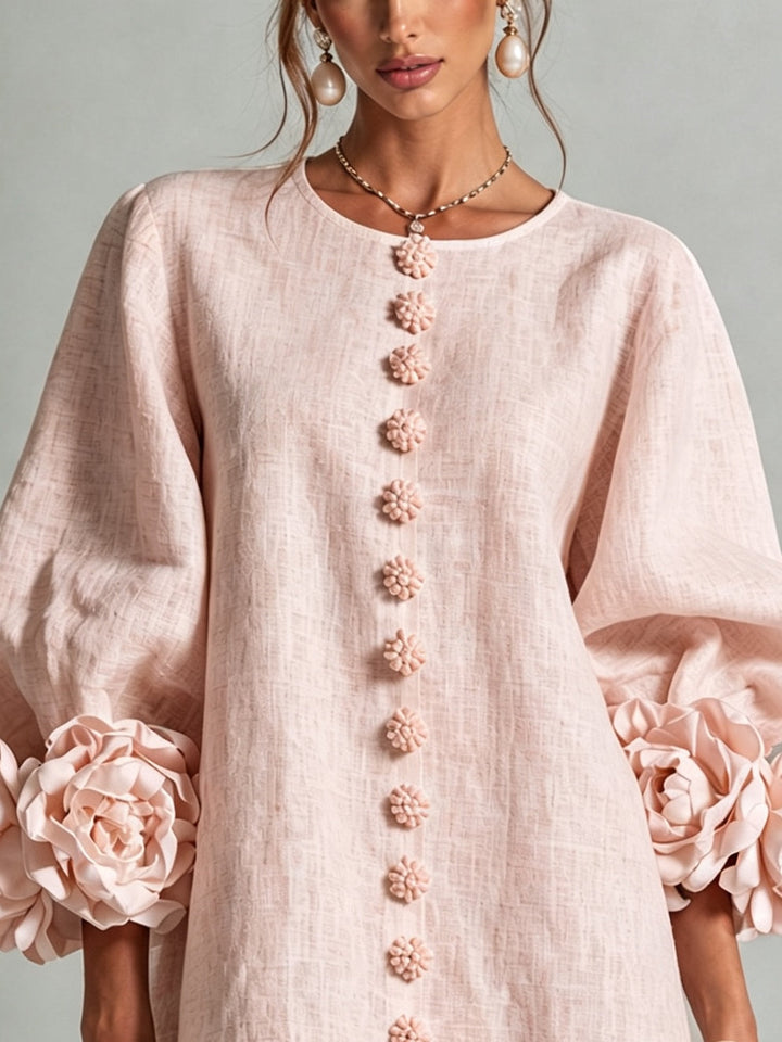 Pink floral mini dress with rosette cuffs