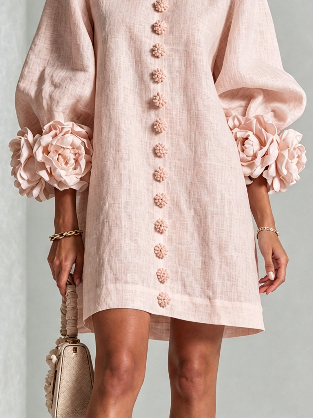 Pink floral mini dress with rosette cuffs