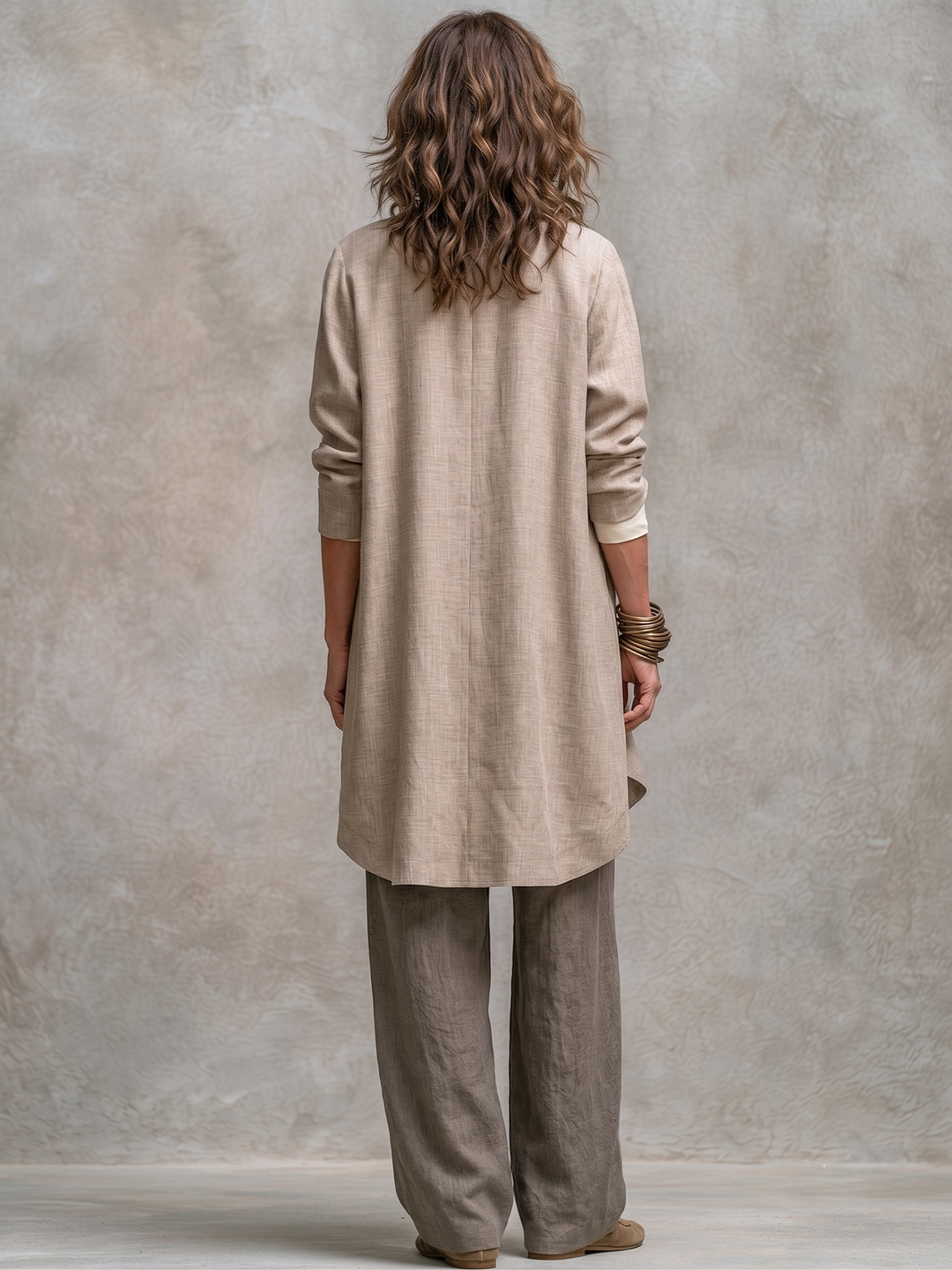 Woman wearing taupe three-piece wide leg pant set