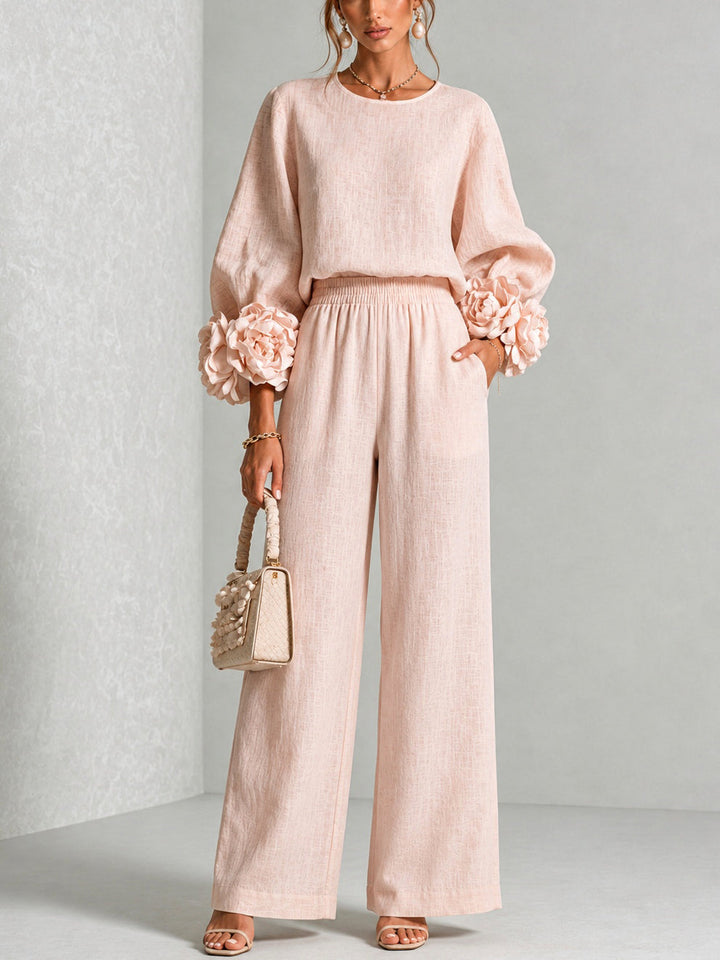 Woman wearing floral two-piece set with wide-leg pants