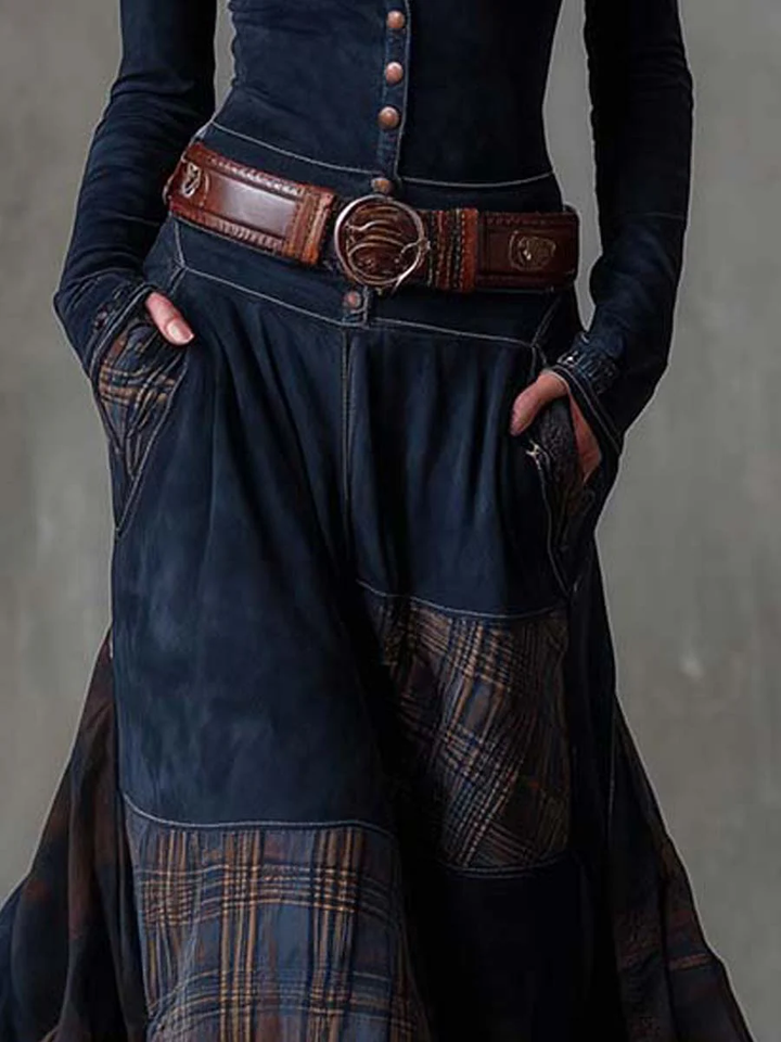 Woman wearing patchwork maxi dress with plaid panels and belt