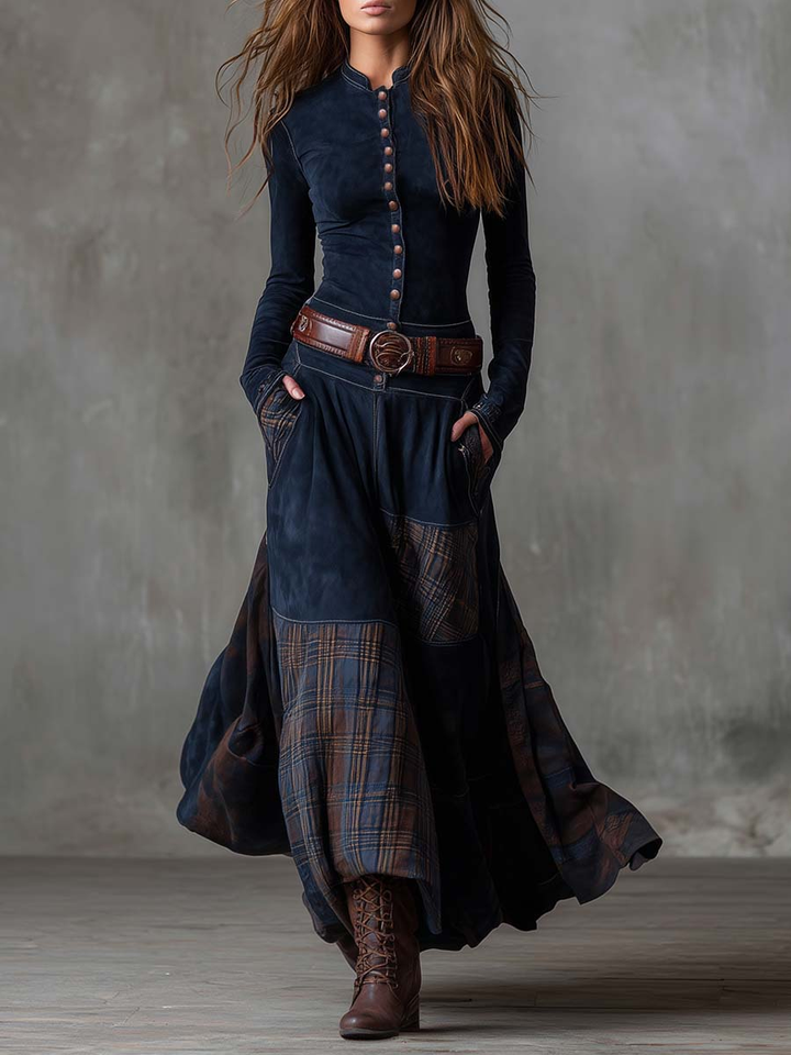 Woman wearing patchwork maxi dress with plaid panels and belt