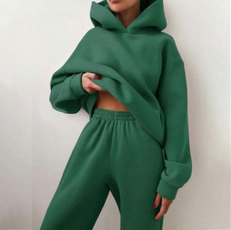 Woman wearing matching hooded knit tracksuit set – dark green