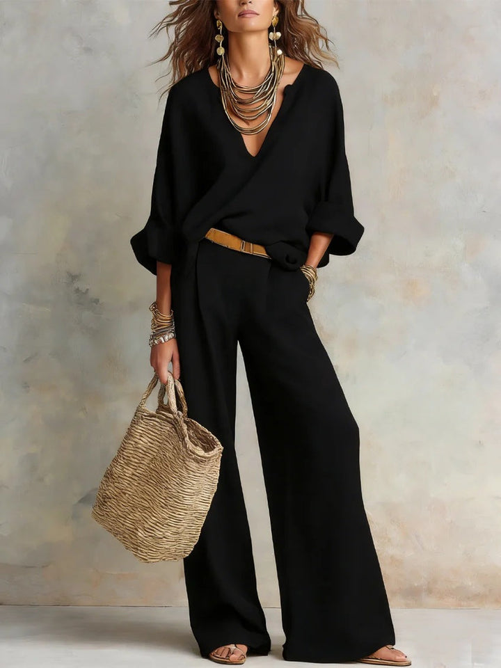 Woman wearing V-neck two piece set with wide leg pants