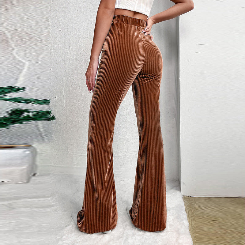 Woman wearing brown high waist corduroy wide leg pants